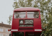 Red Routmaster Bus + Bride in Classic Elegant Jesus Peiro Wedding Dress